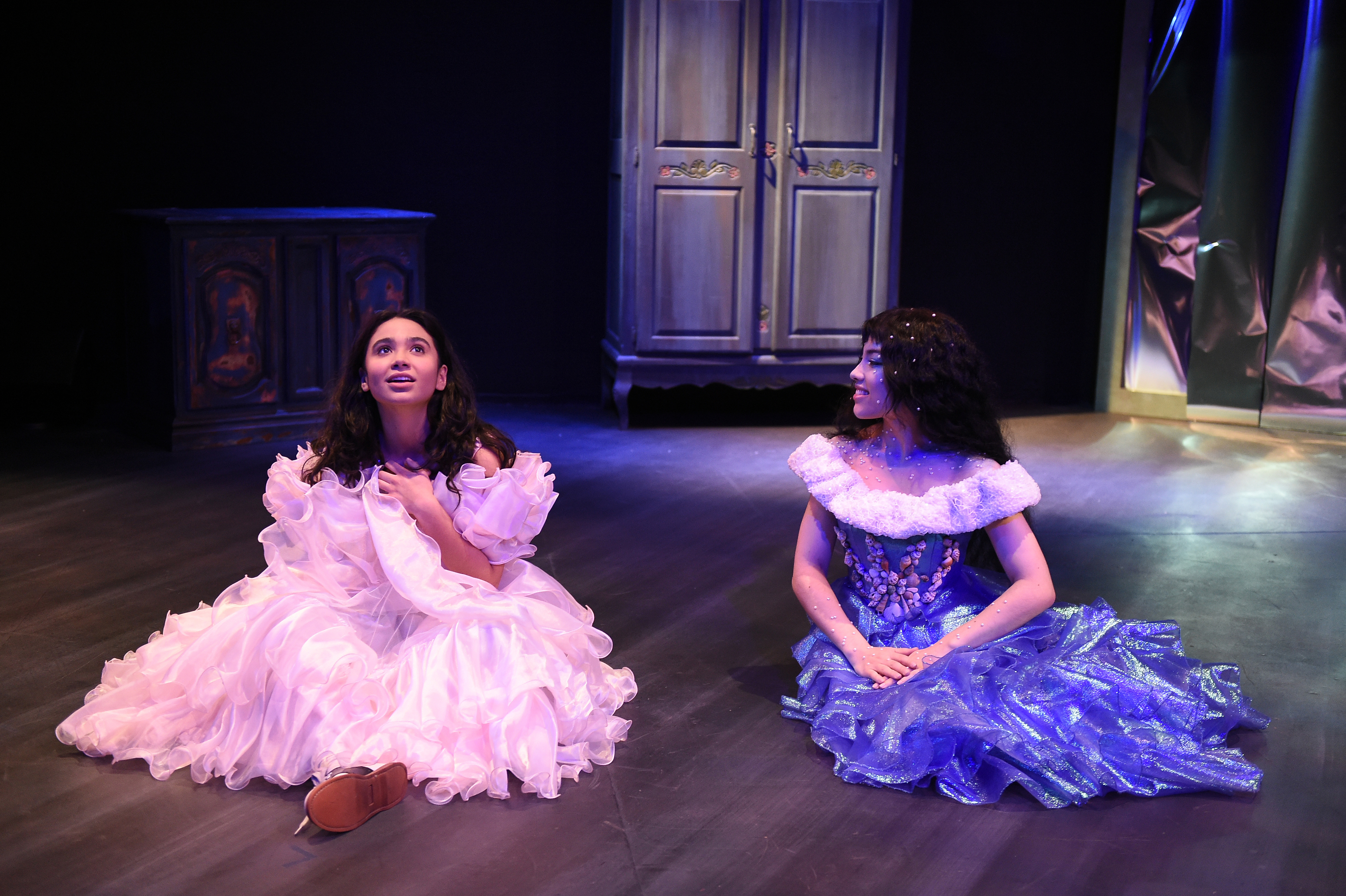 Broken Shells - Two women in ballgowns sitting with armoire