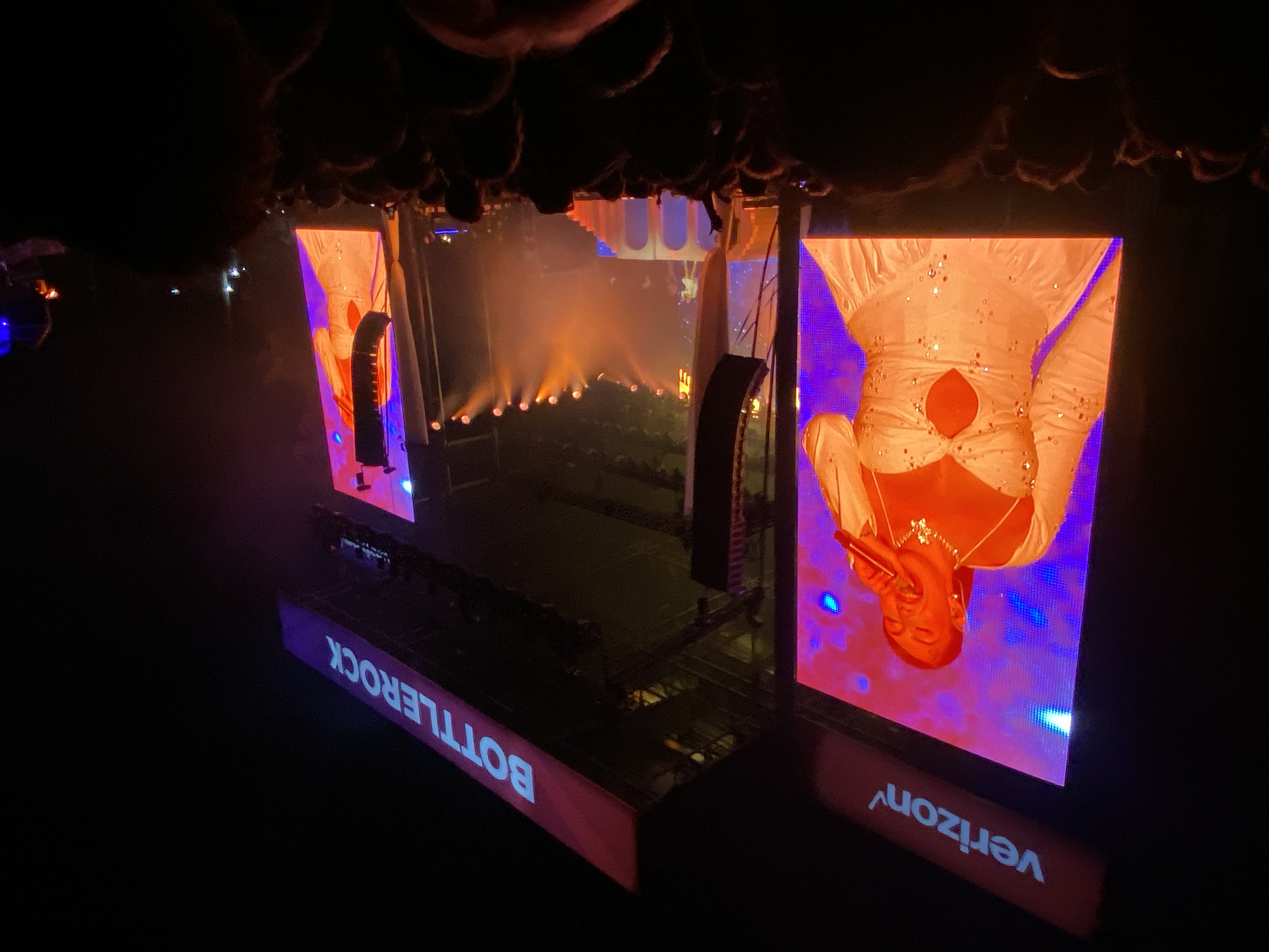 BottleRock nighttime with performer in white dress on big screens