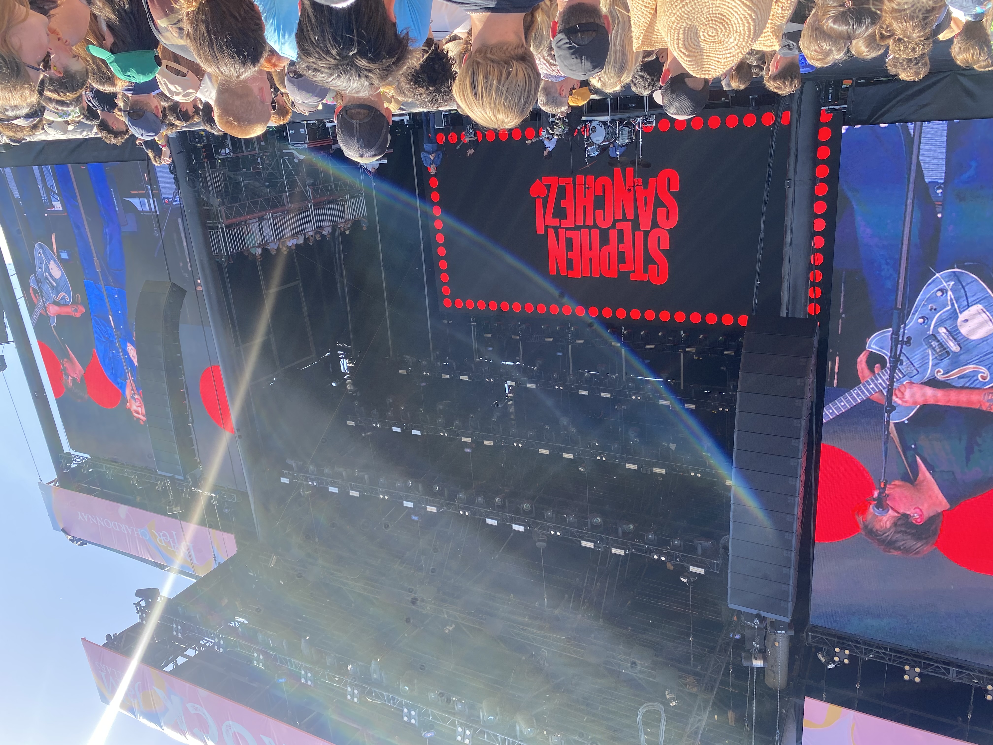 Stephen Sanchez at festival with retro red marquee signage