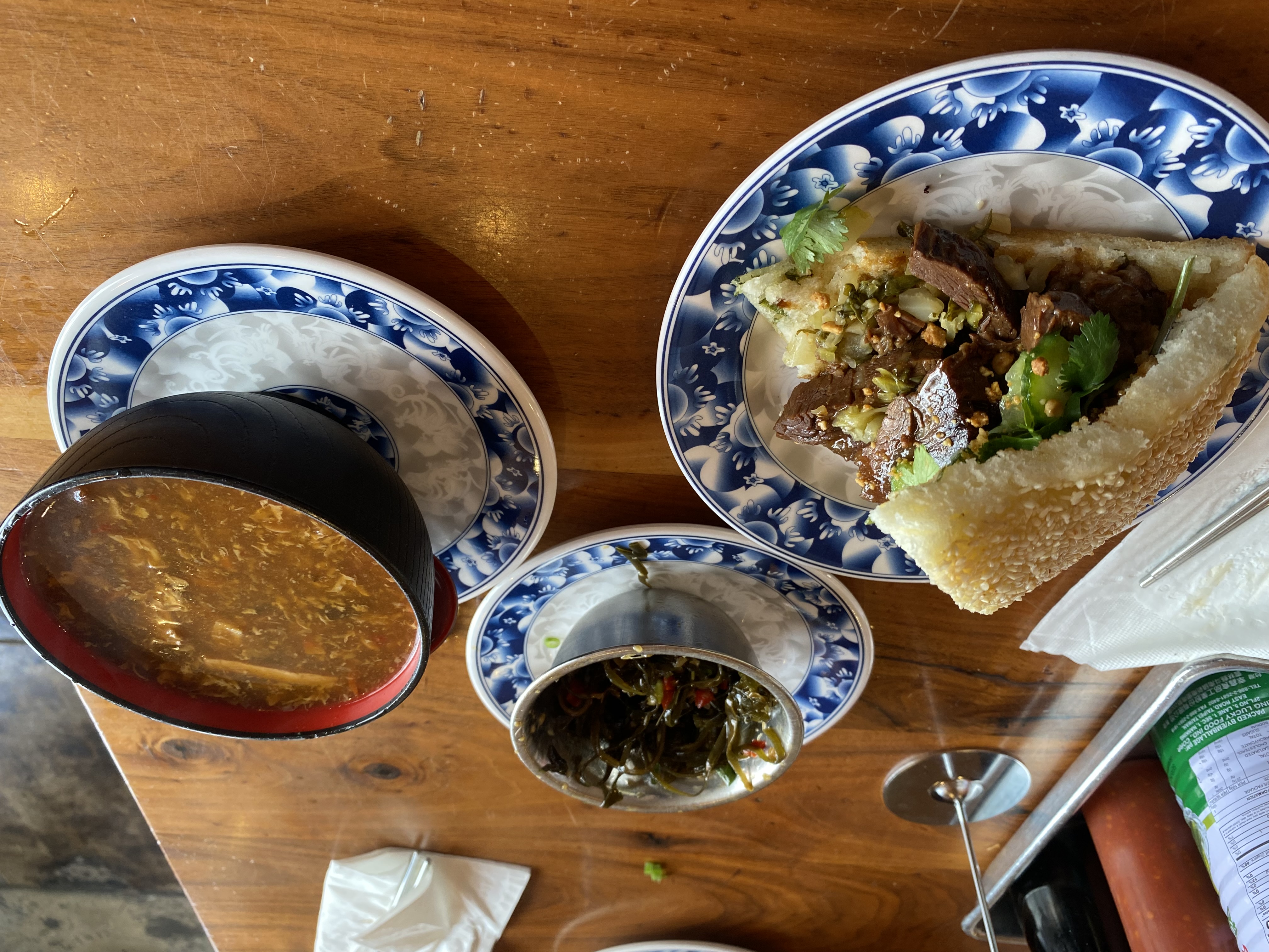 Chinese rou jia mo sandwich with hot and sour soup