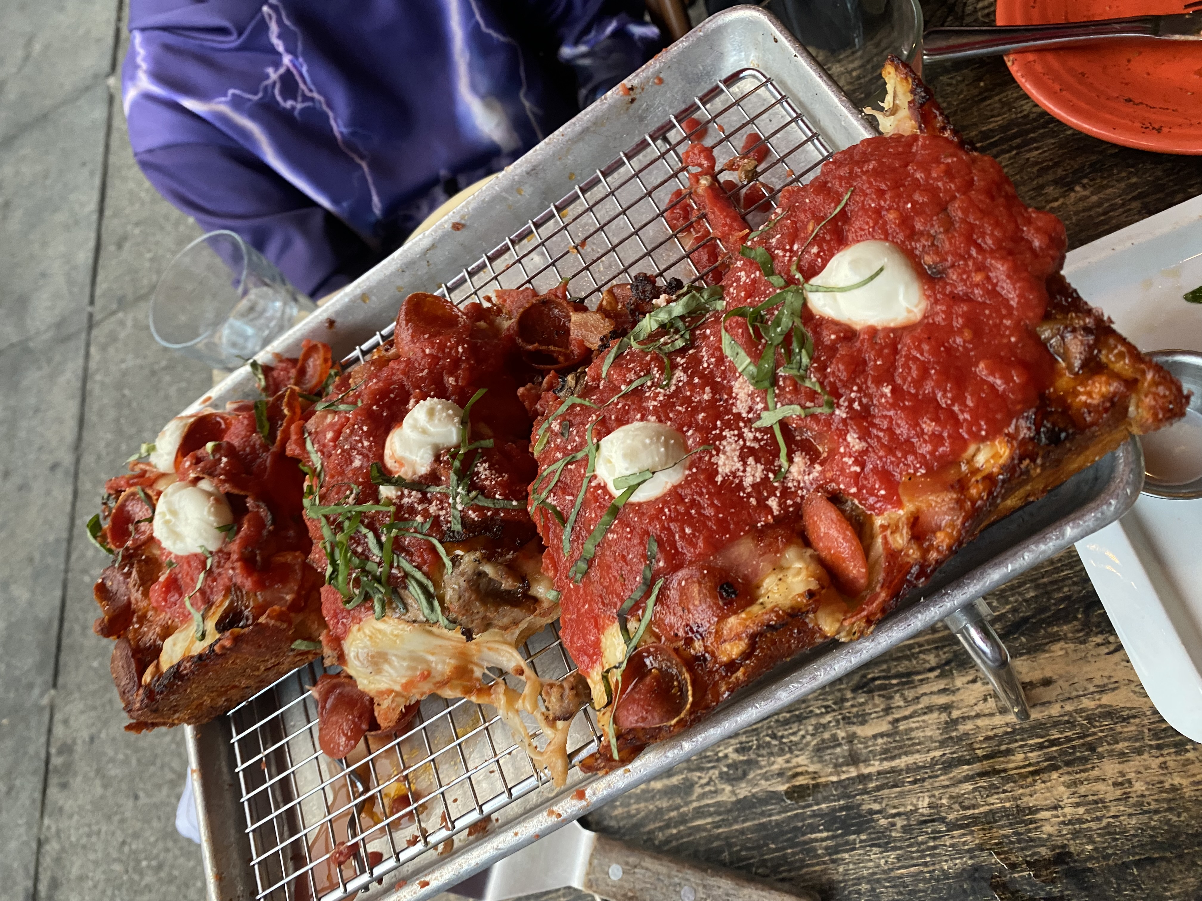 Chicago deep dish pizza slices with mozzarella and basil