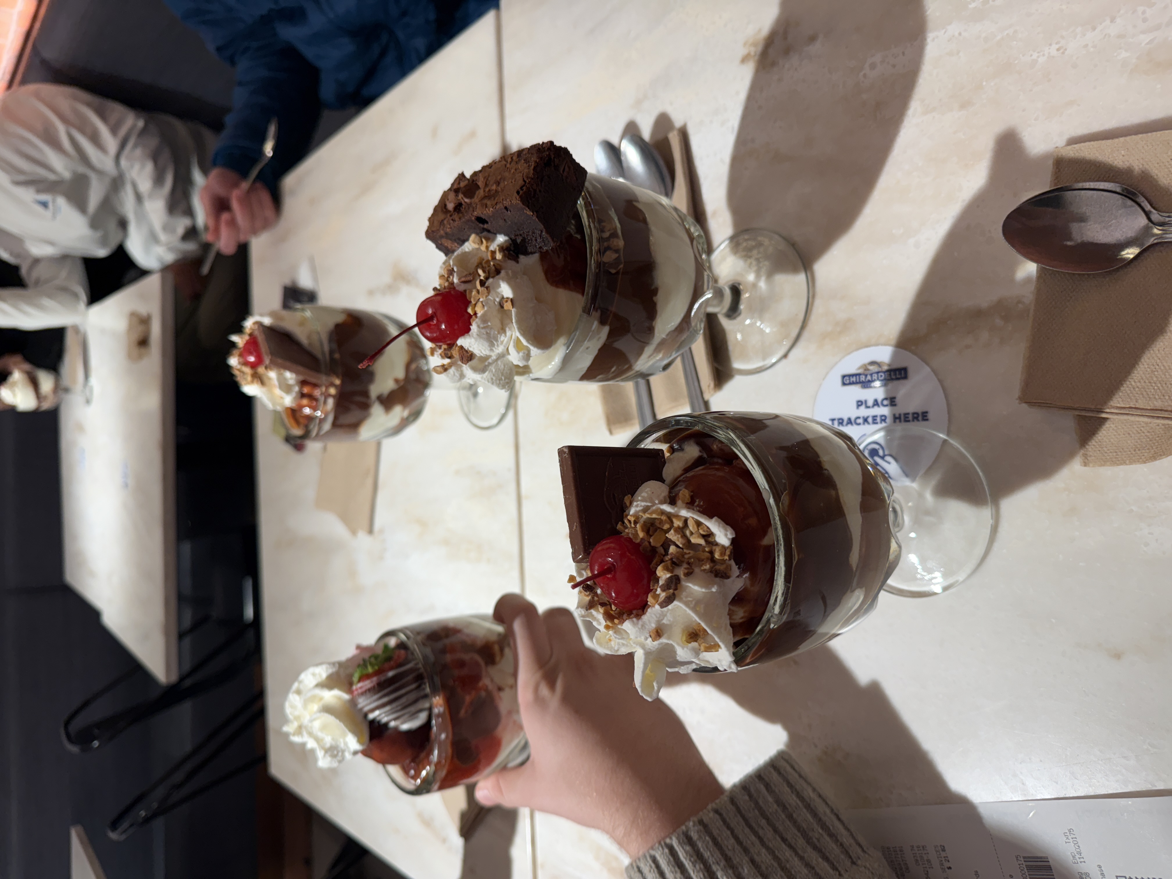 Ghirardelli sundaes with cherries and brownie