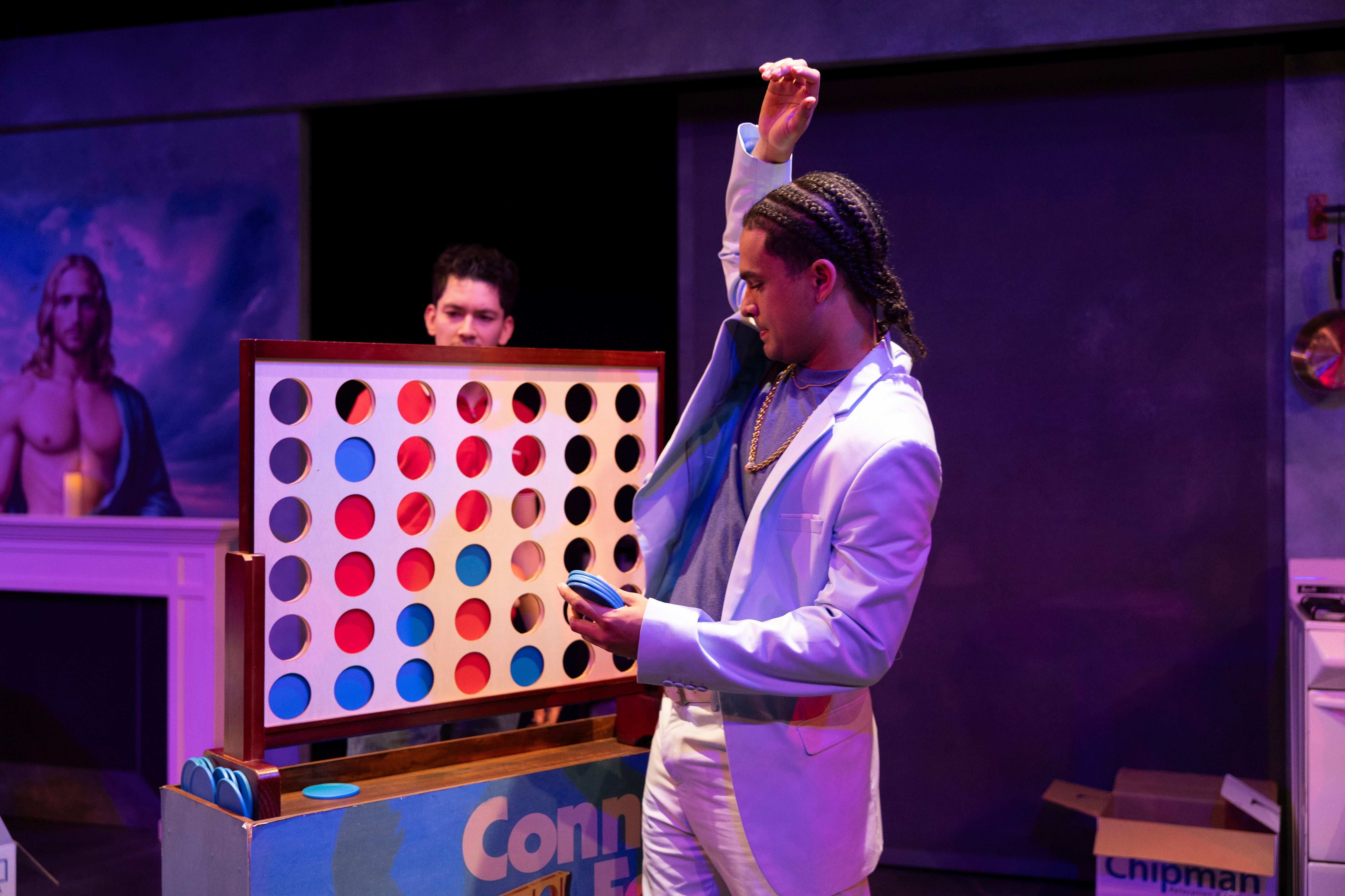 Between Fresno and Hell - Man in white suit playing giant Connect Four