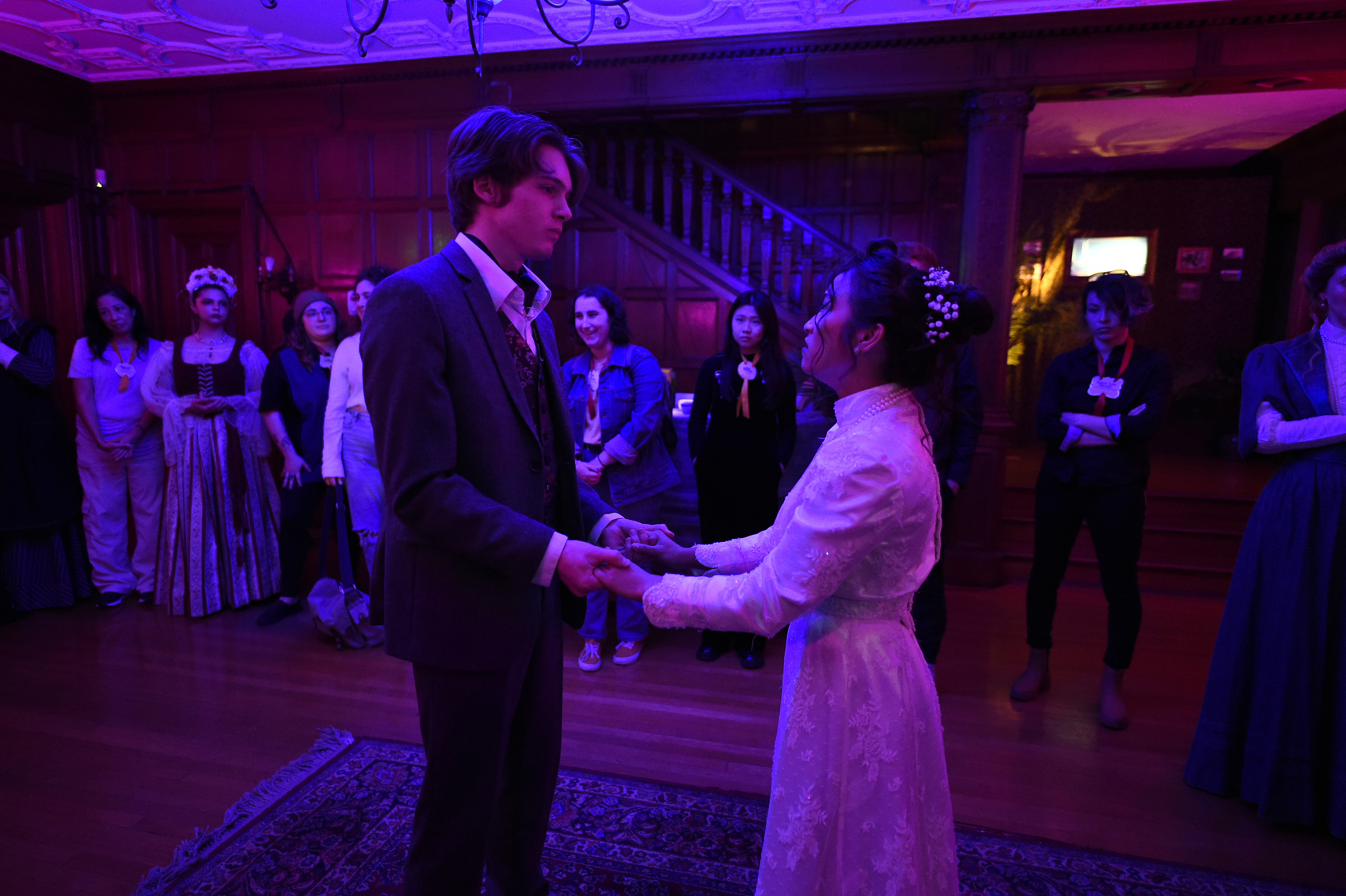 Ghosts of USC - Victorian couple dancing, holding hands in purple light