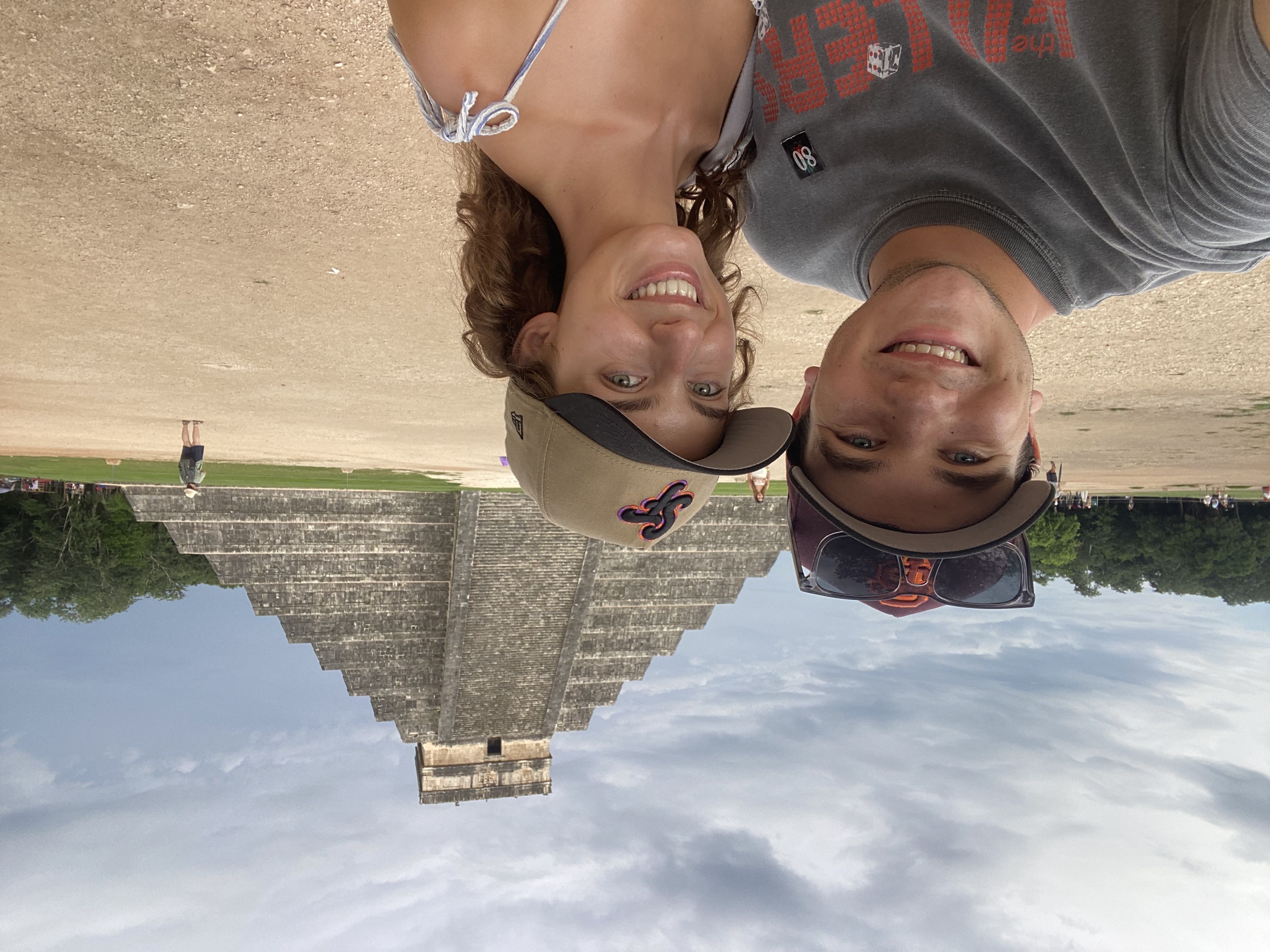 Couple selfie at Chichen Itza with El Castillo pyramid