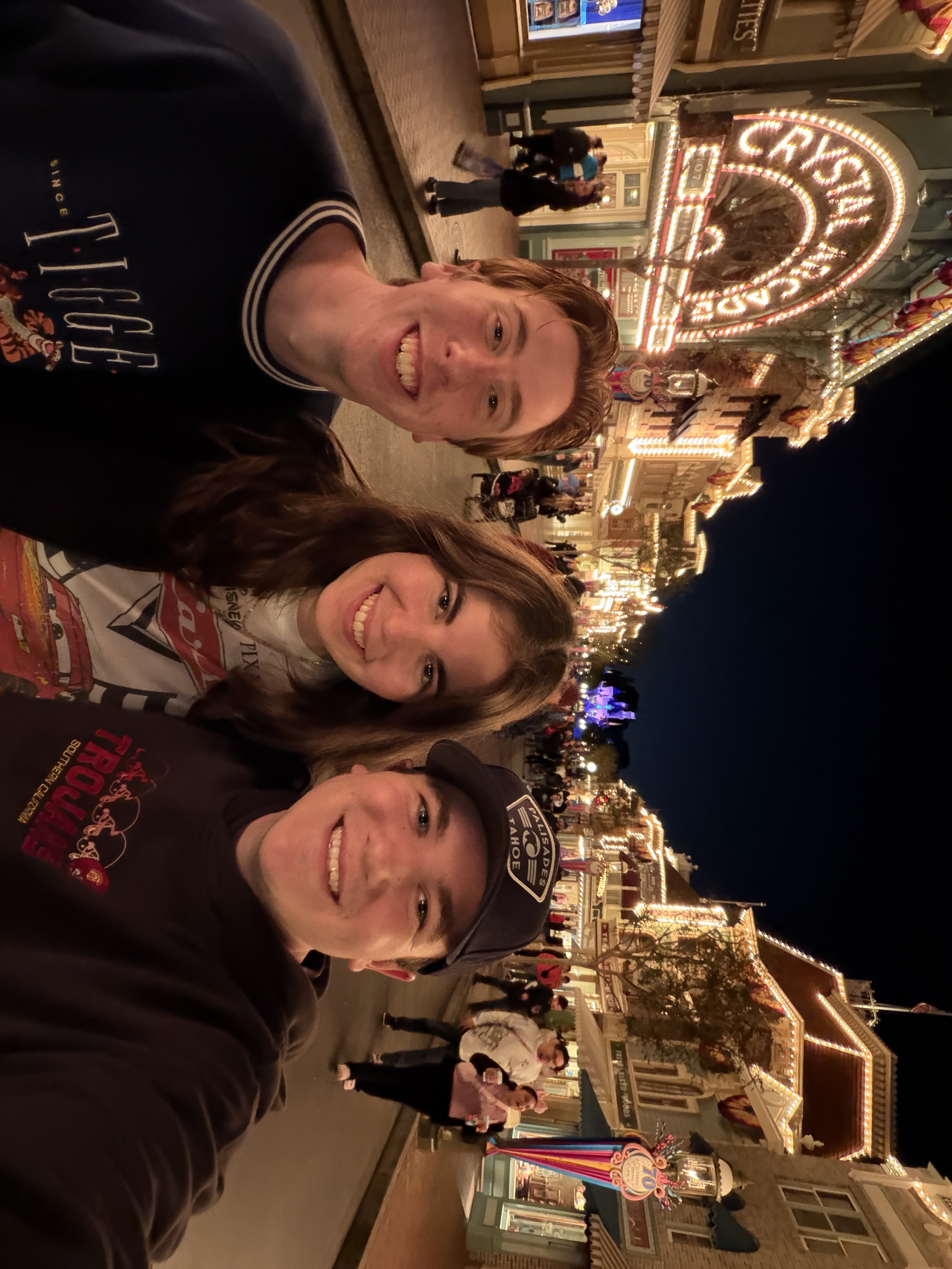 Friends at Disneyland Main Street USA at night