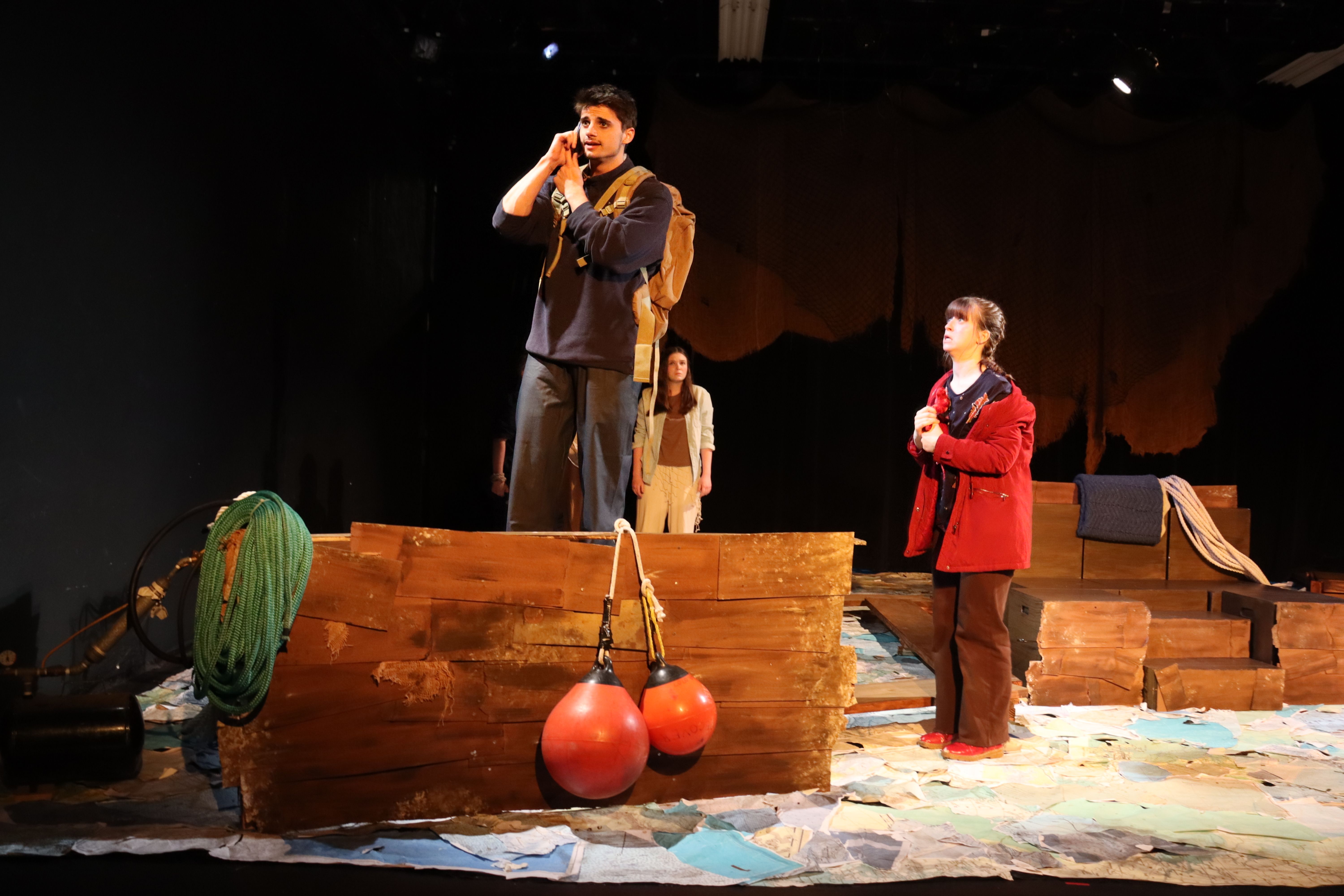 Sea Drift - Two actors on boat set with red buoys