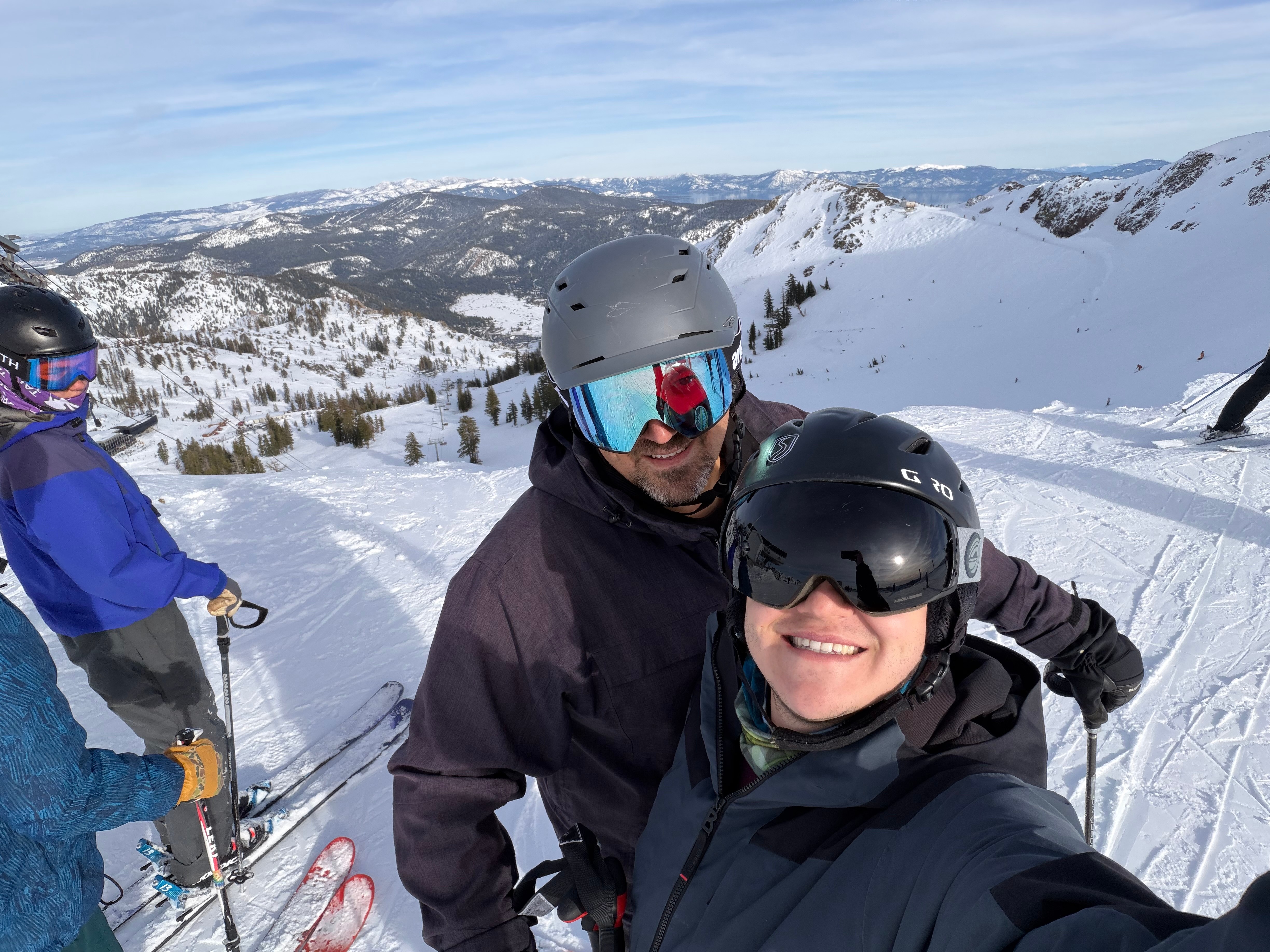 Summit selfie with panoramic mountain views