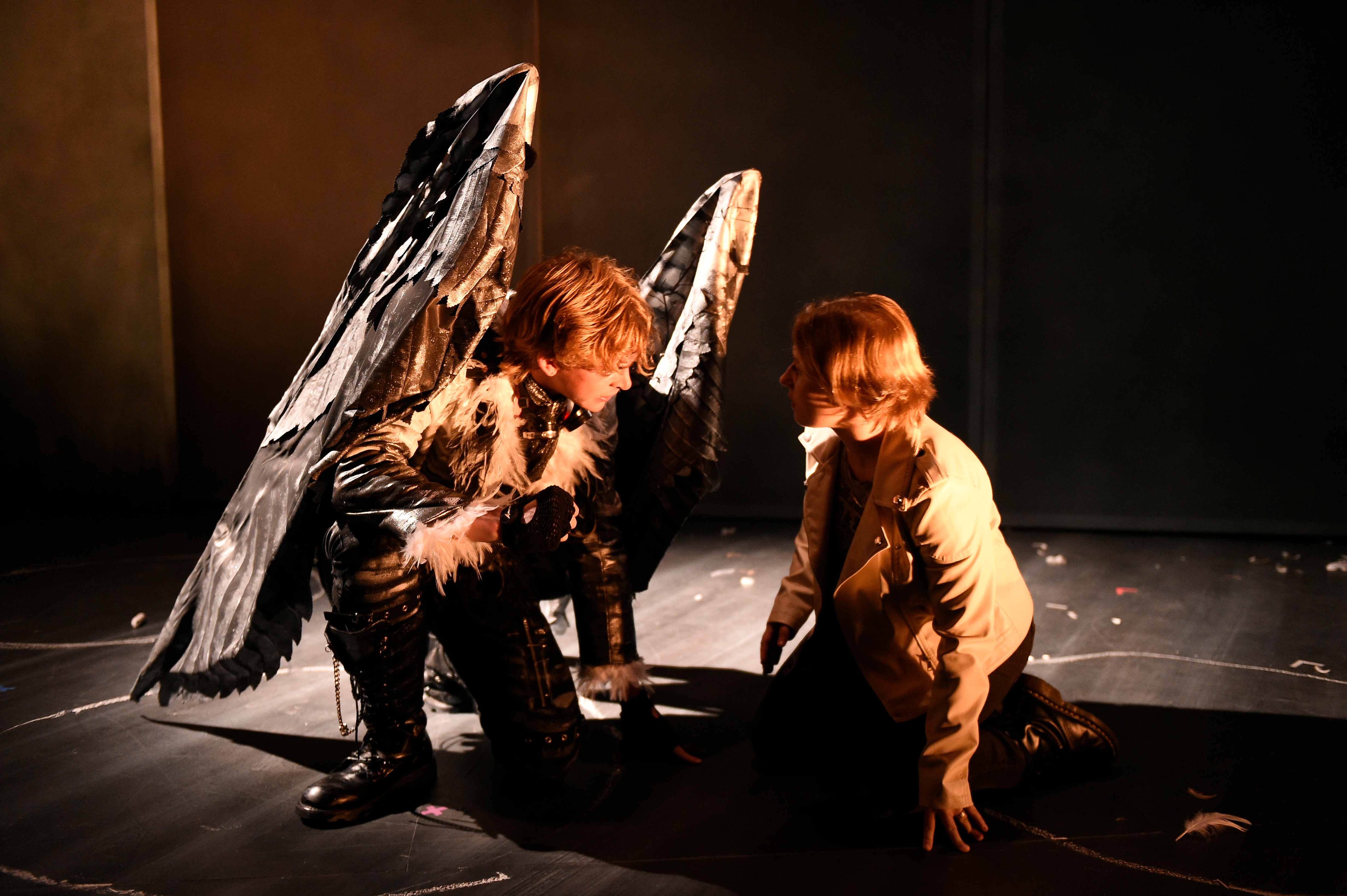 Somewhere Someone - Angel crouching with woman in tan jacket