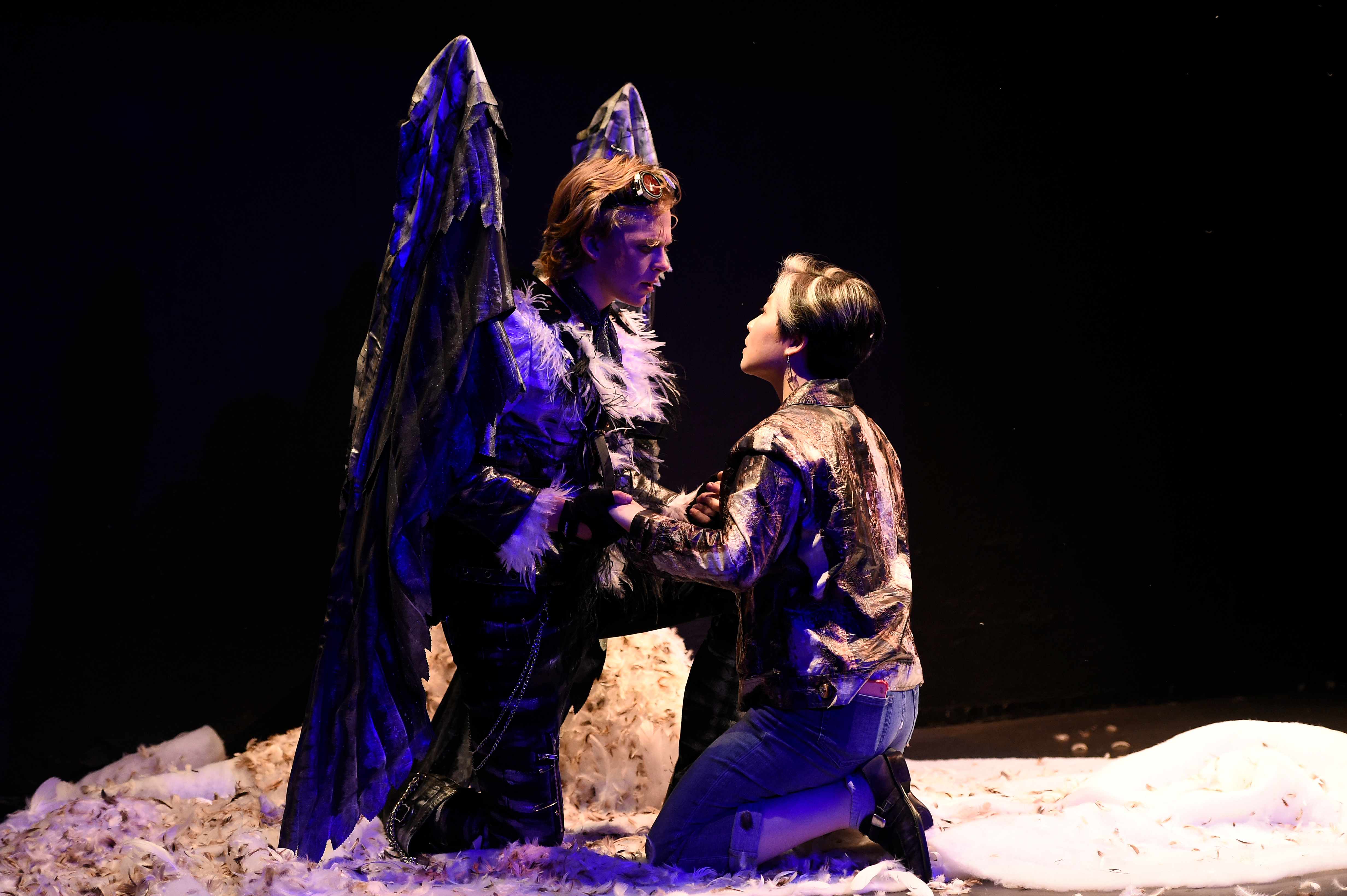 Somewhere Someone - Angel and woman kneeling on feathers, blue-purple light