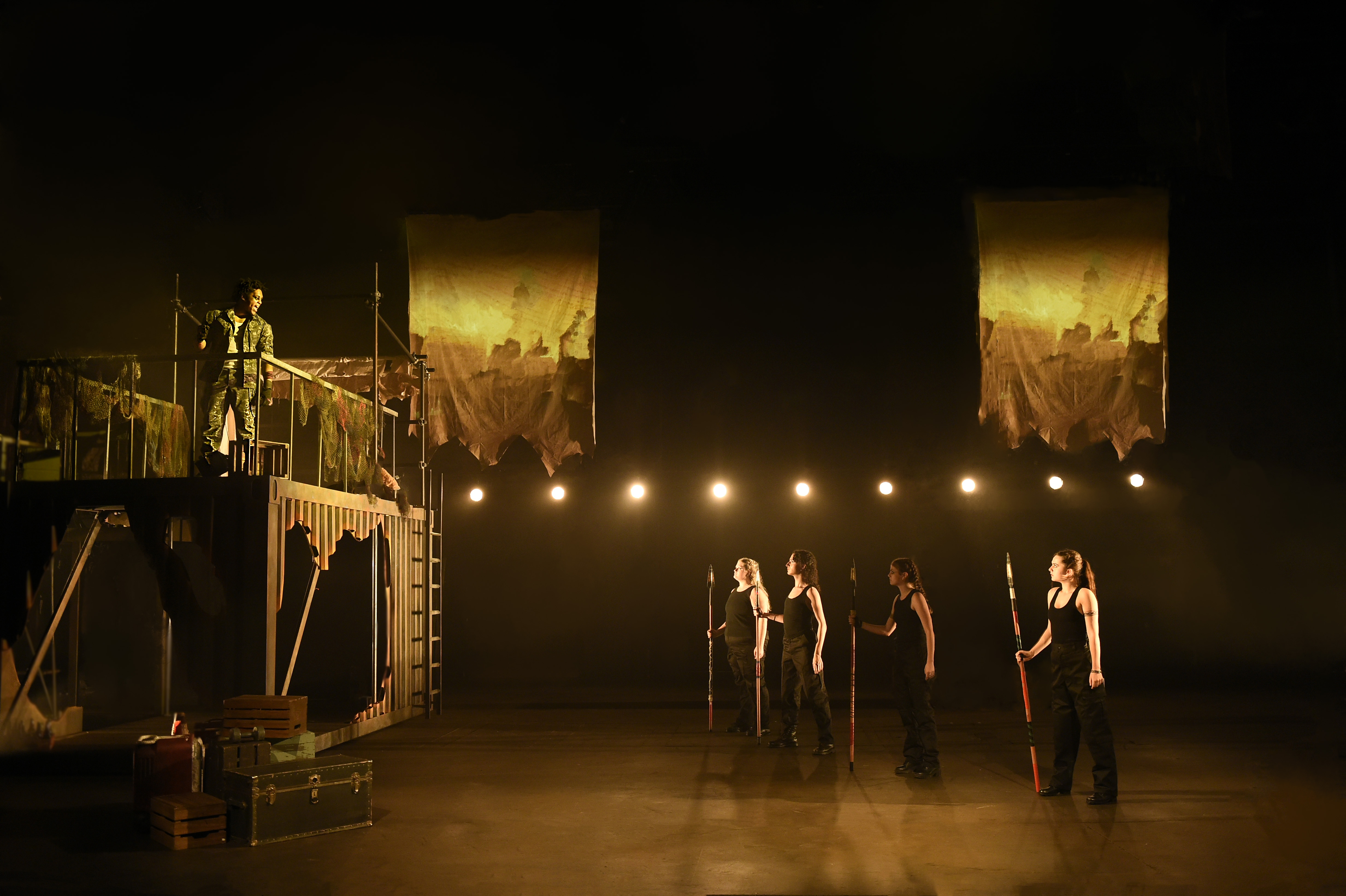 Troilus and Cressida - Chorus with spears facing elevated platform