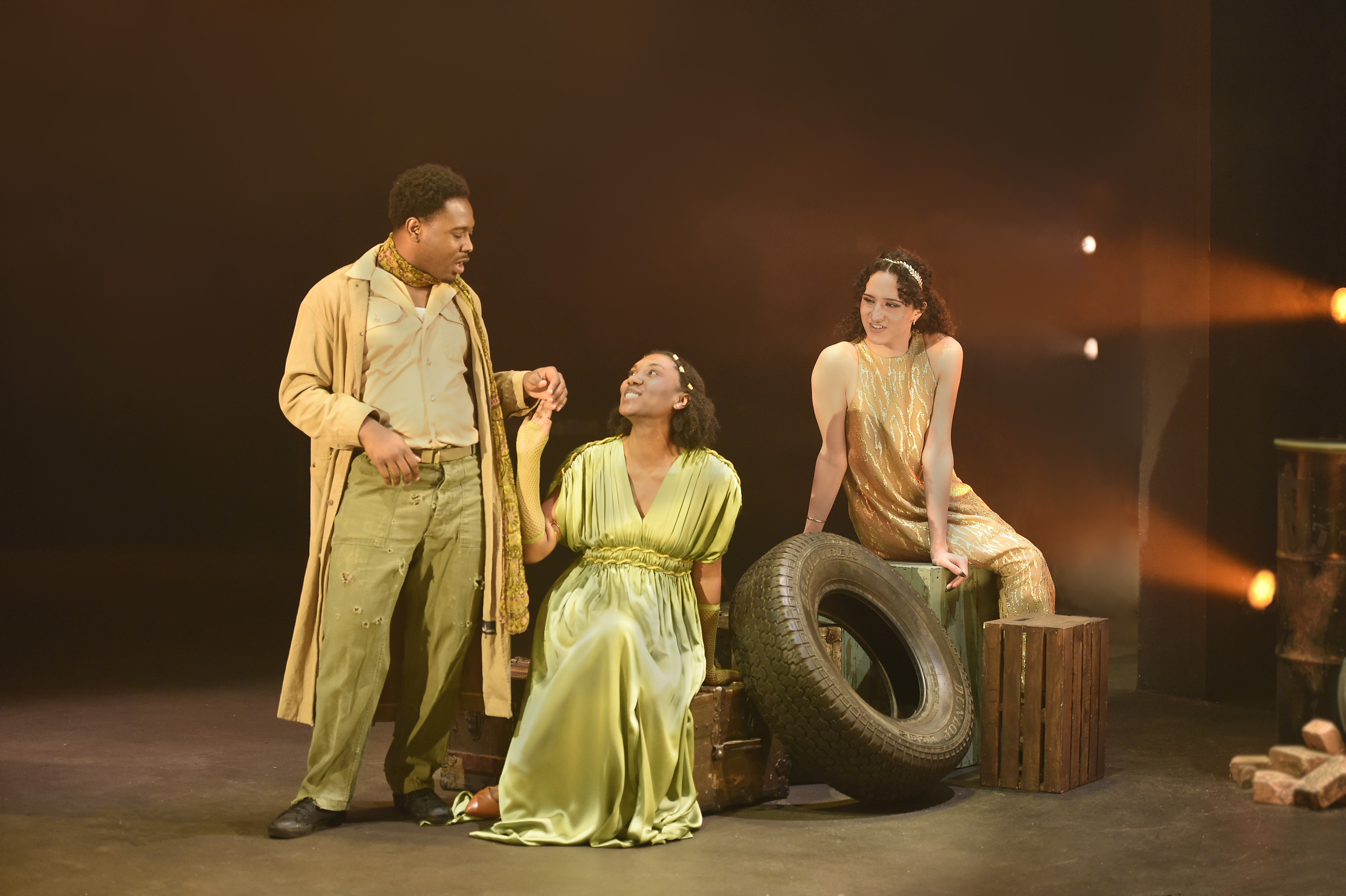 Troilus and Cressida - Trio in golden costumes with warm lighting